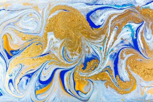istock White, blue and gold marbling pattern. Golden marble liquid texture. 1152978560