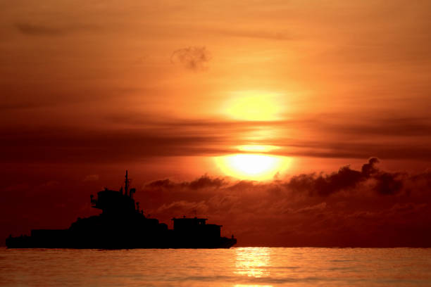 istock Photo set sand dredger and red sky Sunrise 1152979952