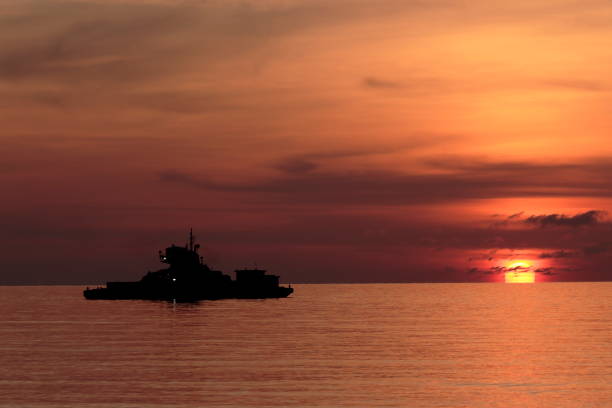istock Photo set sand dredger and red sky Sunrise 1152979988