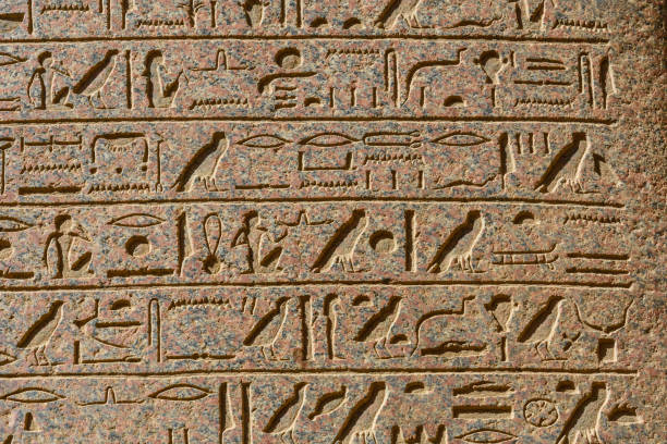 istock Egyptian ancient hieroglyphs on the stone wall 1152980122