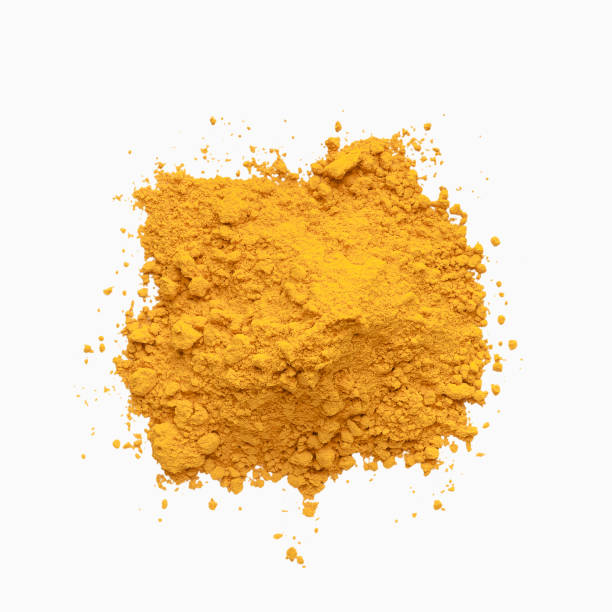 Heap of turmeric powder isolated on white background. Pile of turmeric powder, yellow condiment isolated on white background, top view food coloring stock pictures, royalty-free photos & images