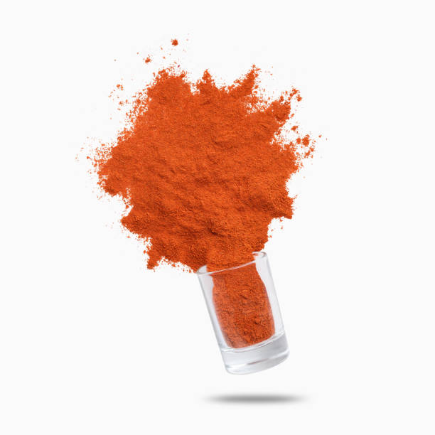 istock Glass jar with paprika flying on white background 1152983653