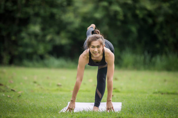 istock Yoga action exercise healthy in the park 1152984585