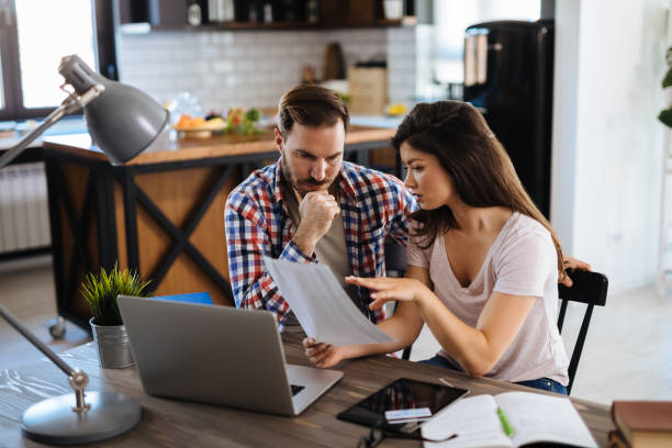 istock Young couple going through their home finances 1152984793