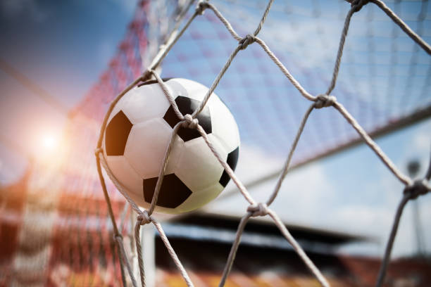 istock Soccer into goal success concept 1152986691