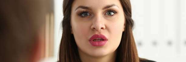 istock Man and smiling mature woman talking in office 1152990663