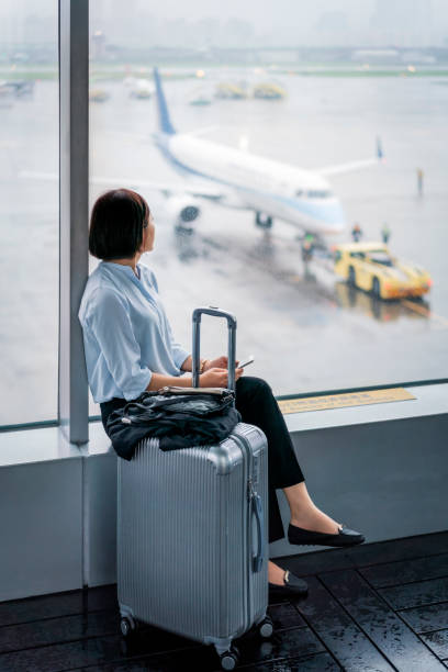 istock Thoughtful businesswoman looking through window 1152995849