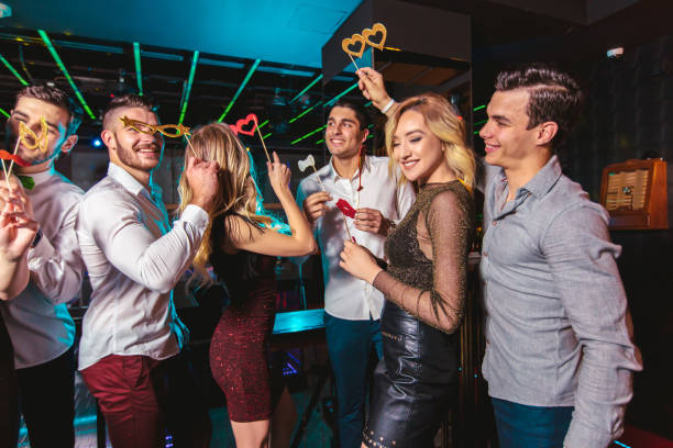 istock Young people dancing in night club 1152997822