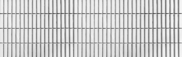 istock Panorama of White brick tile wall seamless background and texture 1153001737