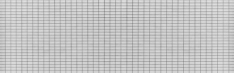 Panorama of White brick tile wall seamless background and texture
