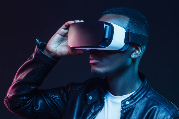 istock Young african man wearing virtual reality headset. VR technology 1153003854