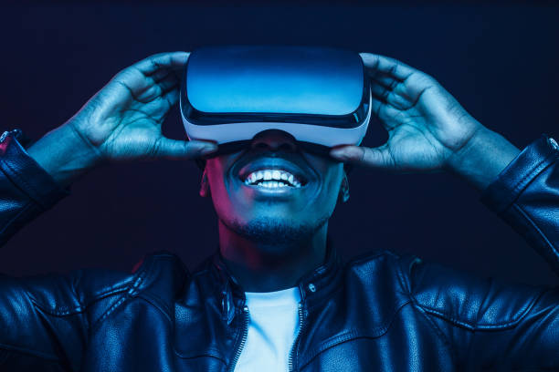 istock African man wearing virtual reality headset having great fun 1153003869
