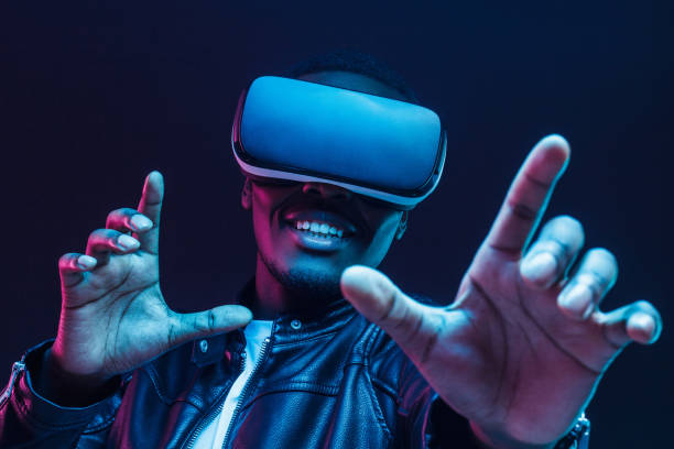 istock African man wearing virtual reality headset having great fun 1153003878