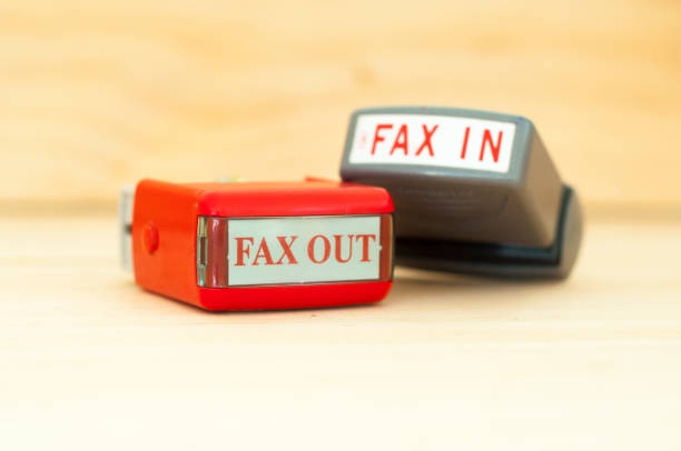 istock Fax in Fax out rubber stamper 1153003925