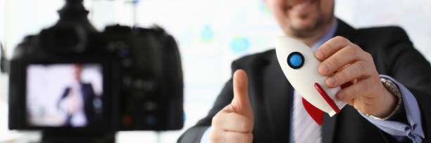 istock Businessman hold rocket in hand closeup 1153004994