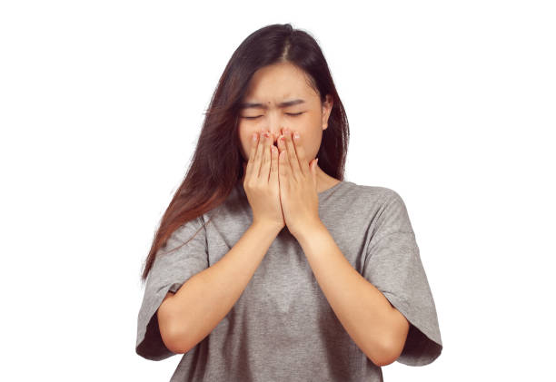 istock young woman in action when get a bad smell. 1153007148