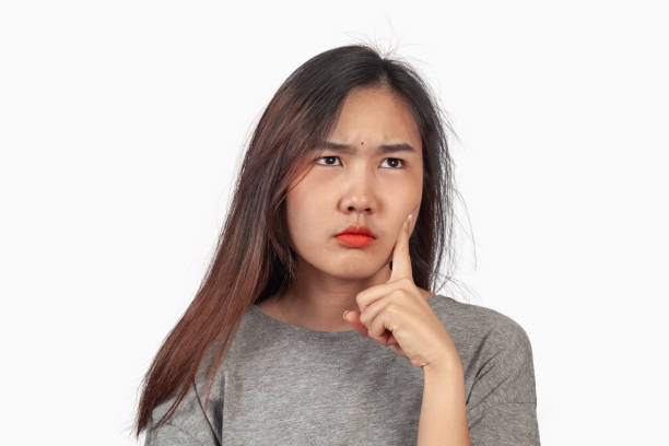 istock young woman in action thinking or get some idea . 1153007172