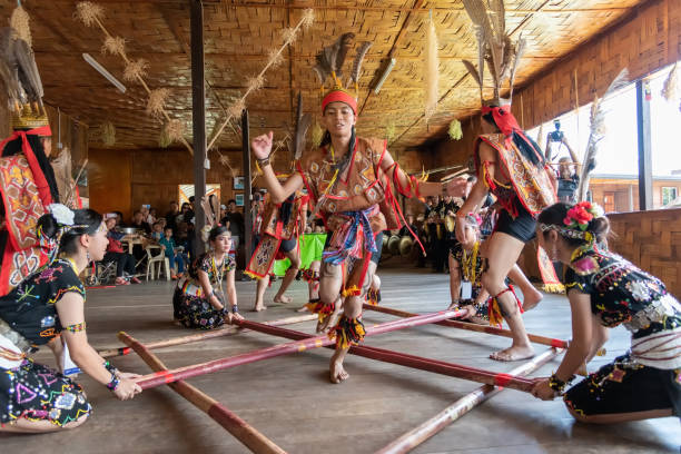 Murut borneo indigenous Magunatip bamboo dancing performance Kota Kinabalu, Malaysia - May 30, 2019: Kadazan Dusun Murut borneo native bamboo dancing performance during state level Harvest Festival in KDCA, Kota Kinabalu, Sabah Malaysia. kadazandusun stock pictures, royalty-free photos & images