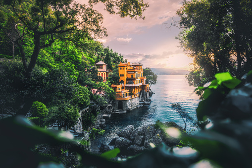 Beautiful nature landscape, seacoast with colorful houses at summer sunset time in Portofino, Italia