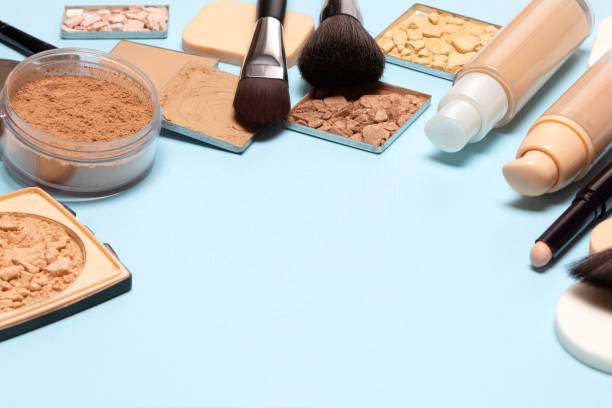 istock Makeup products to even skin tone and complexion with copy space. Primer, concealer, foundation, powder, highlighter, bronzer. Make-up cosmetics background 1153019638