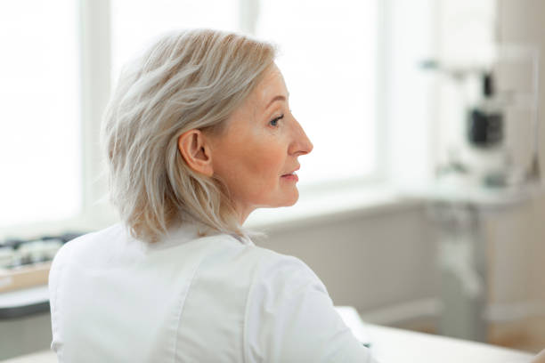 istock Good-looking middle-age ophthalmologist having intense working day 1153021731