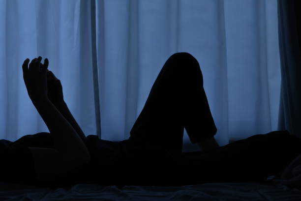 istock Woman lying in bed 1153021823