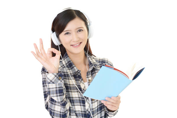 istock Woman studying with headphones 1153023132