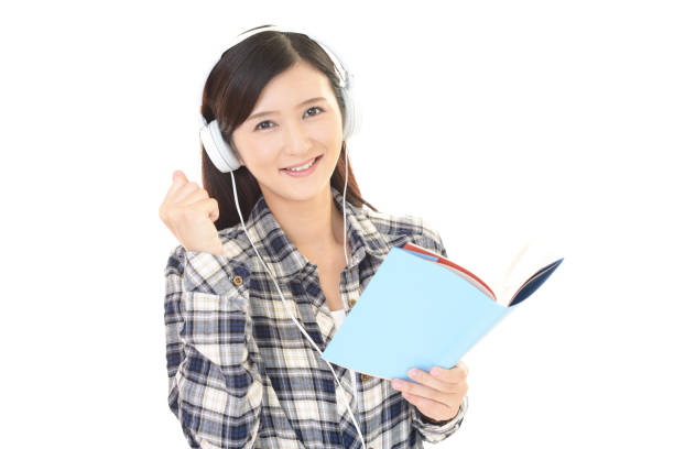 istock Woman studying with headphones 1153023948