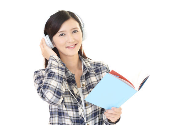 istock Woman studying with headphones 1153023962