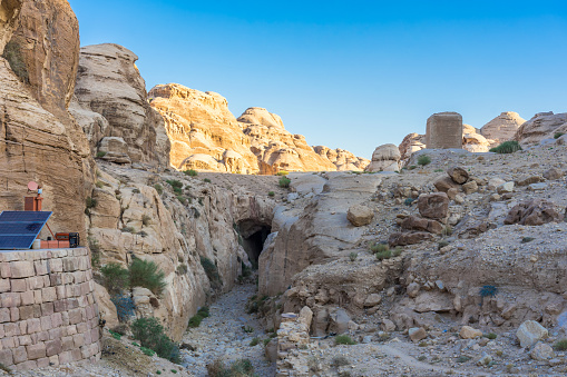 The Siq - narrow slot-canyon, entrance passage to Petra (Red Rose City), Jordan. UNESCO world heritage site