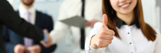 istock Female arm show OK or approval with thumb 1153026505