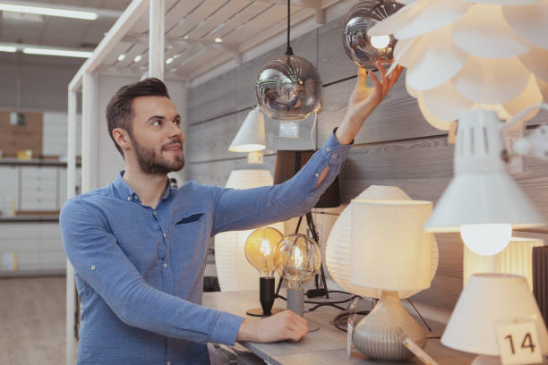 istock Handsome man shopping at furnishings store 1153028107
