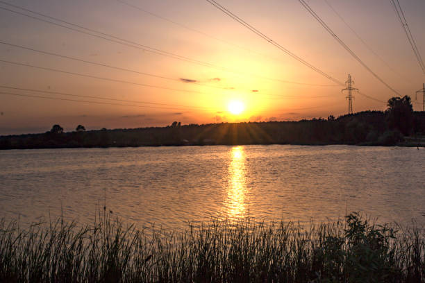 istock Sunset over the lake. Beautiful summer landscape. 1153028950