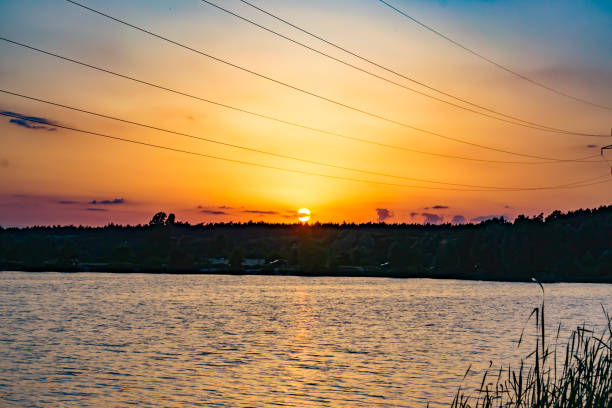 istock Sunset over the lake. Beautiful summer landscape. 1153029042