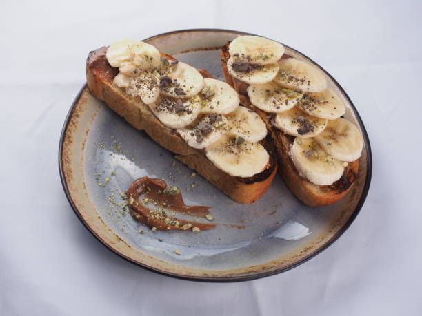 istock Toast with banana, chocolate and pistachios 1153030279