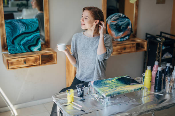 istock Beautiful artist having a coffee break 1153031450
