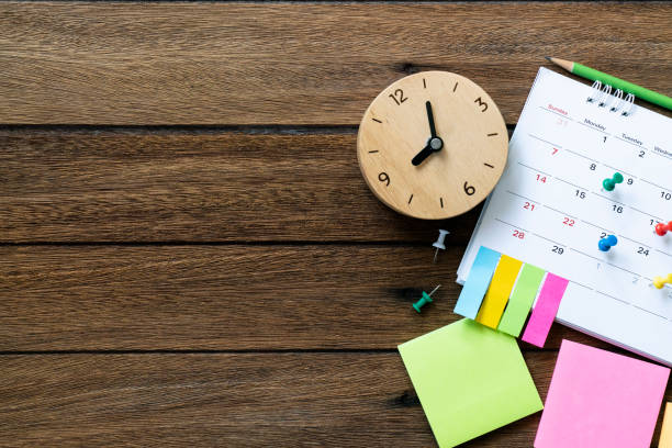 close up of calendar and clock on the table, planning for business meeting or travel planning concept - calendar personal organizer diary event imagens e fotografias de stock