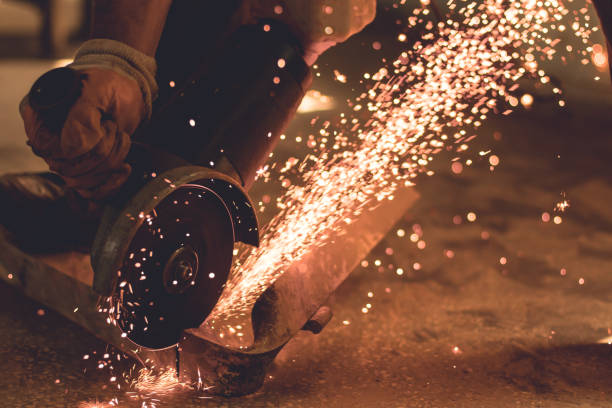 istock Person cutting metal with an angle grinder 1153034037