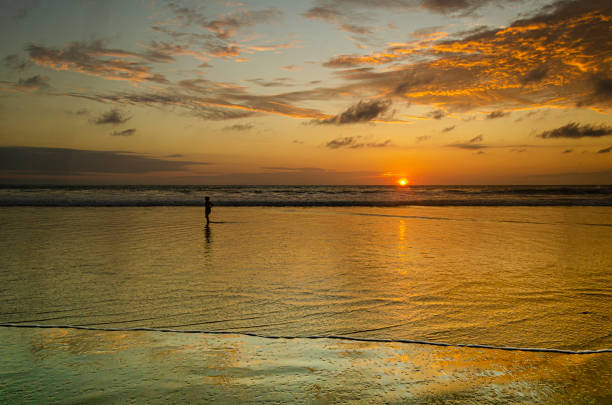 late afternoon at the beach. Montanita Ecuador sunset on the beaches of the village of Montañita. Ecuador montanita ecuador stock pictures, royalty-free photos & images