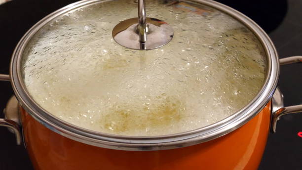 istock Chef cooks the potatoes in a saucepan. 1153035146