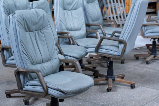istock Several gray leather office chairs ready for packaging in a furniture warehouse, online furniture store 1153035821