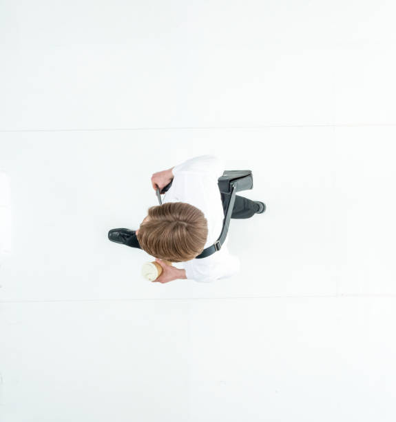 istock Directly above view of businessman walking 1153037283