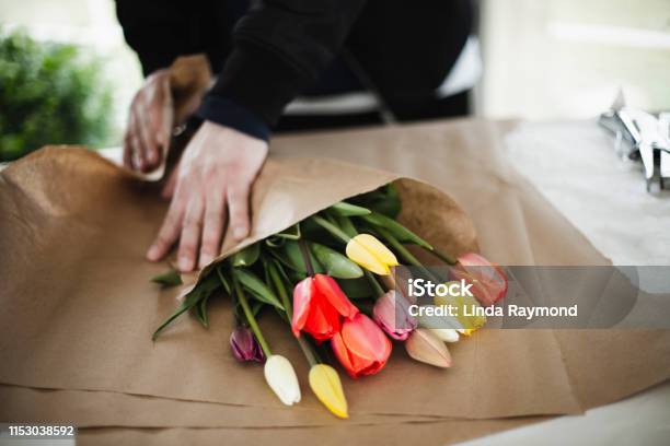 Bunch Of Rainbow Tulips In Brown Paper Wrap Stock Photo - Download Image Now - Florist, Flower Shop, Flower