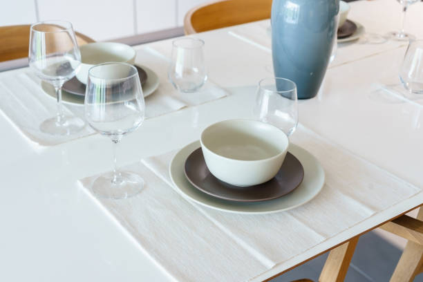 istock table set on wood dinning table at home 1153038911
