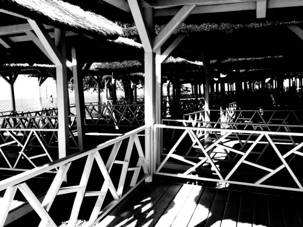 A row of gazebos in the beach in the sunlight