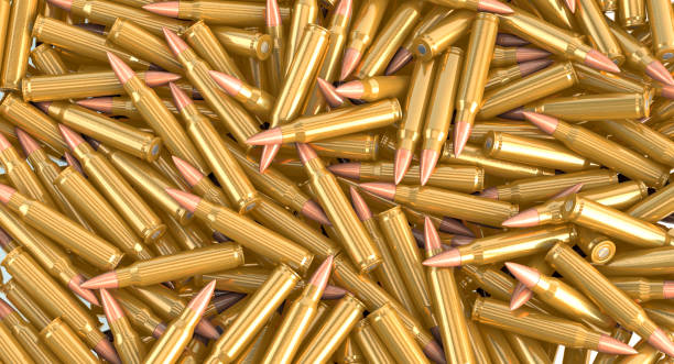 istock Nato machine gun ammunition cartridges lying on a pile - 3d illustration 1153042450