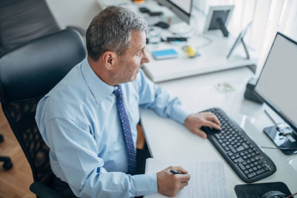 istock Senior businessman working 1153042491