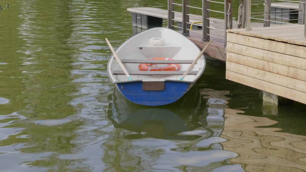istock The empty boat bobs on the waves of heavy seas. 1153042708