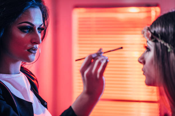 istock Professional make-up artist applying makeup on a model 1153048829
