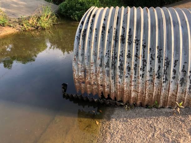 istock Large metal drain pipe - drainage ditch 1153049517